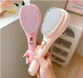Self Cleaning Comb in pink color designed for easy hair grooming and detangling with self-cleaning feature.